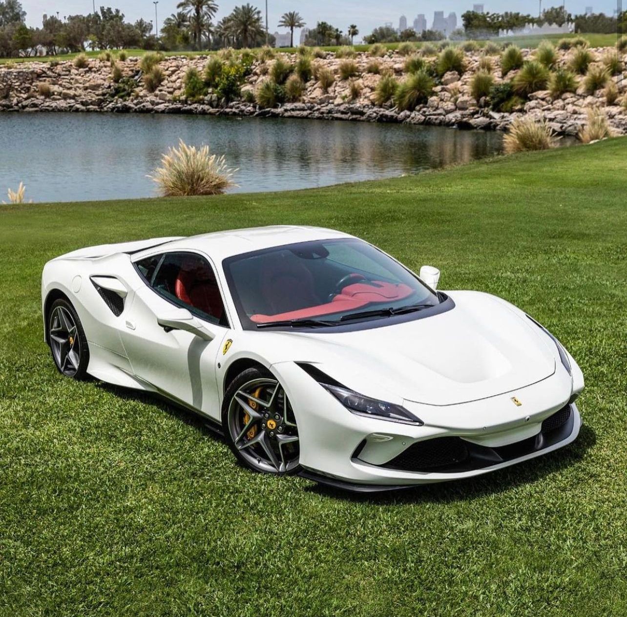 White Ferrari F8 Tributo on the grass