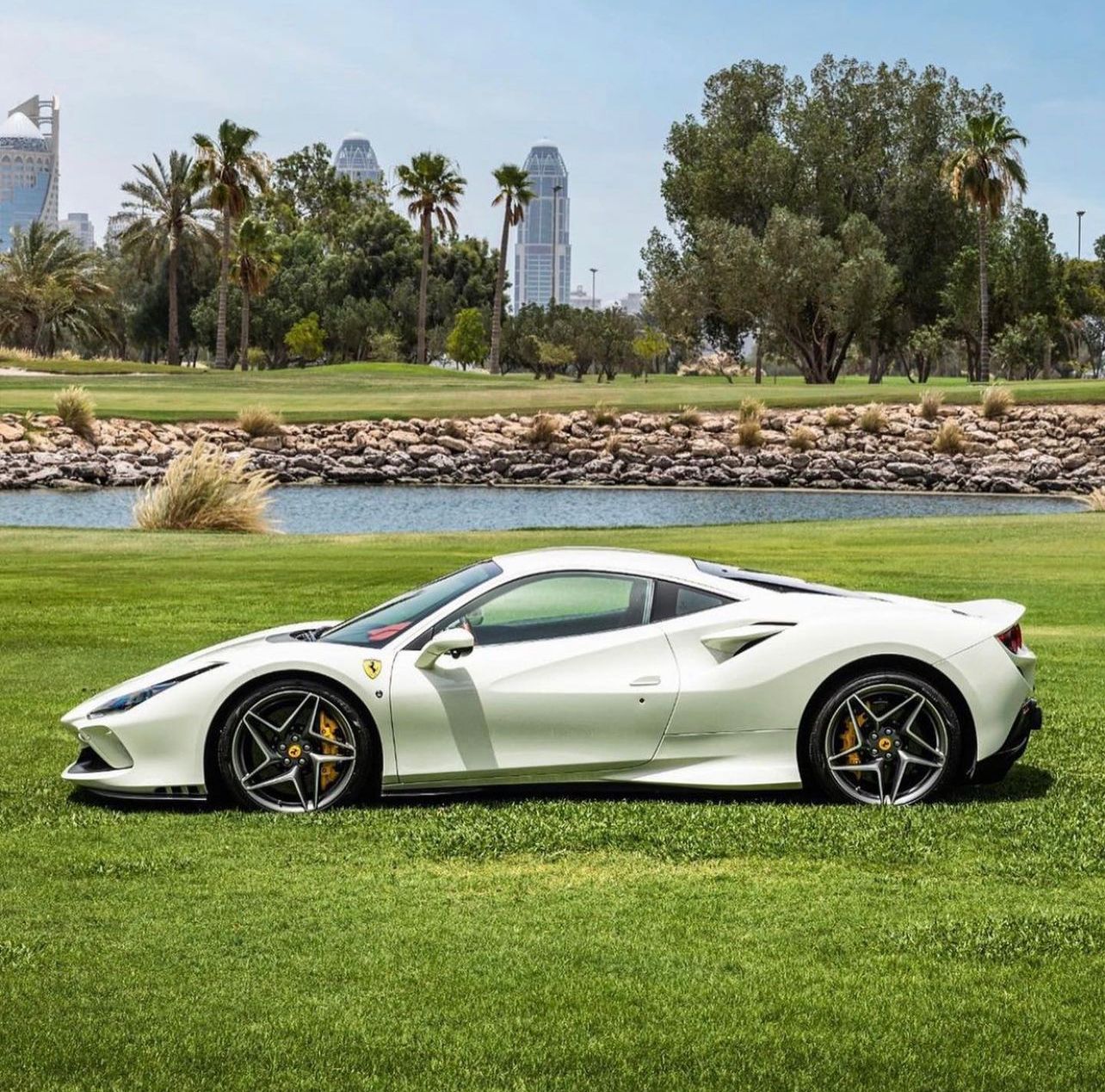 White Ferrari F8 Tributo on the grass